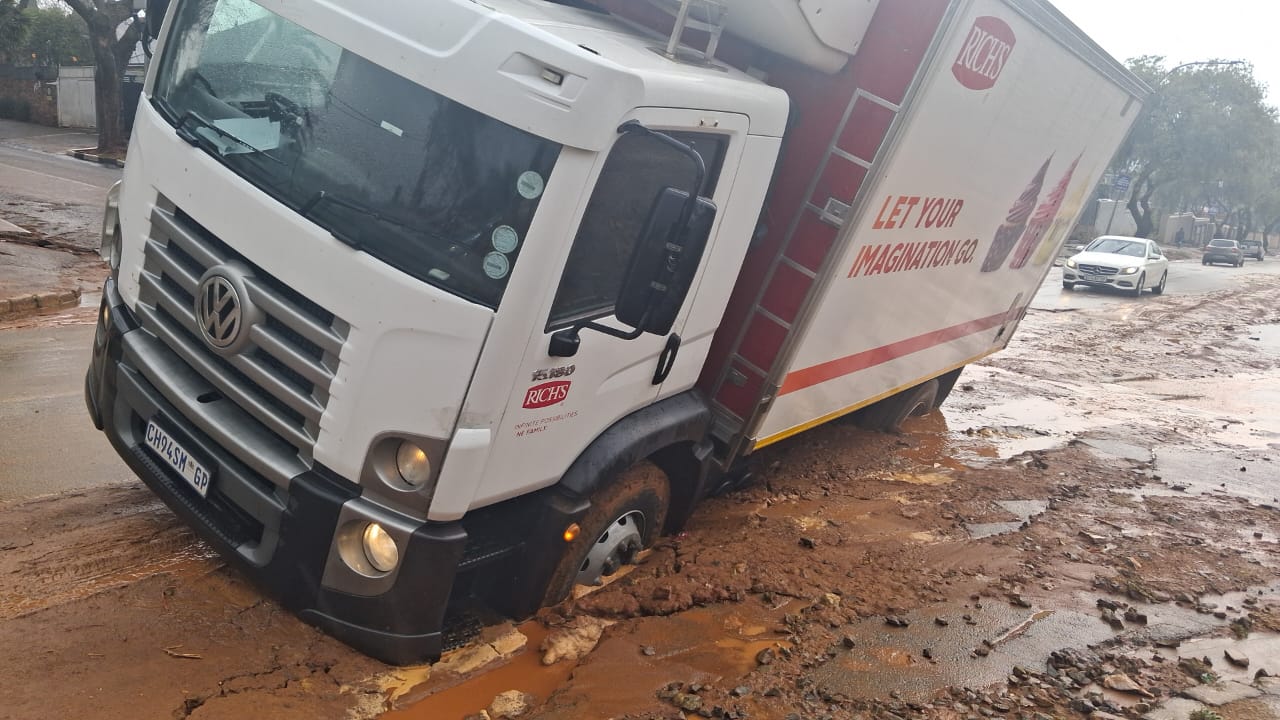 a truck in a pot hole
