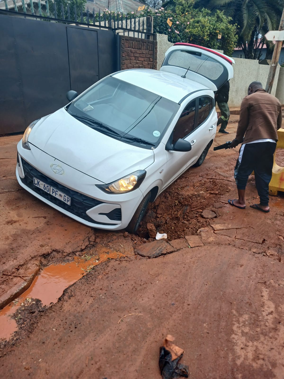 a car in a pot hole